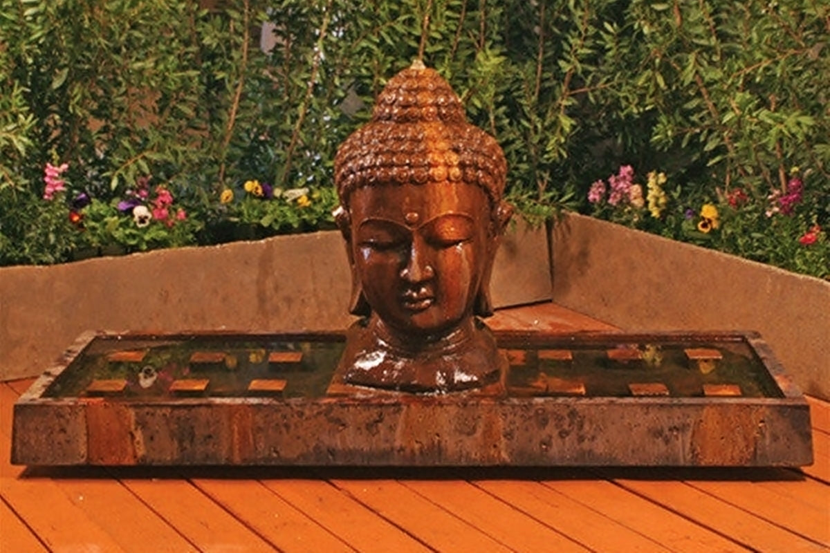large buddha head outdoor fountain